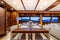 Interior shot of a yacht with a dining table and couches