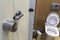 Interior of simple restroom toilet, view from above. White ceramic toilet lavatory ceramic seat on copy space background of light