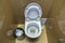 Interior of simple restroom toilet, view from above. White ceramic toilet lavatory ceramic seat on copy space background of light