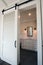 Interior sliding barn doors into bathroom