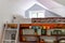 Interior of a small cozy decorated roof bedroom with a single bed