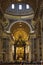 The interior of St. Peter`s Basilica in the Vatican. Baroque canopy over the altar, above the canopy rises a Department dedicated