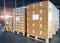 Interior of Storage Warehouse. Stacked of Package Boxes Wrapped Plastic Flim on pallet rack.