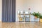 interior of stylish loft. spacious apartment with large windows, parquet on the floor and light walls. closeup view of shelving