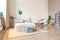 interior of stylish loft. spacious apartment with large windows, parquet on the floor and light walls. closeup view of shelving