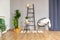 interior of stylish loft. spacious apartment with large windows, parquet on the floor and light walls. closeup view of shelving