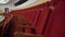 The interior of the theater arts. The auditorium with seats and balcony. Soft focus. Seats in the theater. Red seat on the balcony