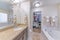 Interior of a traditional bathroom with a carpeted walk-in closet