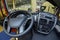 Interior of a truck cabin: seat, wheel, dashboard