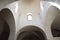 Interior of trullo church with archs and windows, Alberobello, Italy