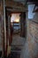 The interior of a Tudor house, with the bricks exposed and dark wood beams