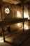 An interior view of an abandoned Hebrew Jewish synagogue bathed in rays of light.