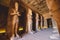 Interior View with an Ancient Egyptian Statues of Ramesses linked to the god Osiris in the Great Temple at Abu Simbel