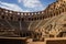 Interior View of Ancient Roman Amphitheater, A Timeless Architectural Wonder, An ancient Roman amphitheater standing tall and