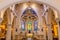 Interior view of beautiful colorful church with empty pews