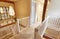 Interior View Of Beautiful Stairs And Landing With Exposed Wooden Beams In Family House