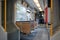 Interior view of a corridor inside passenger trains with blue fabric seats of German railway train system.