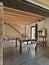 Interior view of a dining room overlooking on the entrance with concrete floor