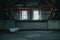 Interior view of an empty and abandoned building with a dirty bathtub