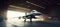 interior view of a generic military fighter jet parked inside a military barracks or