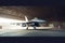 interior view of a generic military fighter jet parked inside a military barracks or hangar as wide banner with copyspace area for