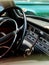 Interior view of old vintage car. View on dashboard of classic car