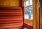 Interior view of a vintage, first class passenger train.