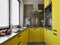 Interior view of a yellow modern kitchen
