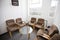 Interior of waiting room with chairs and table in television station