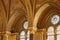 Interior wall with arched stained glass windows in Parliament House, Budapest, Hungary; are painted and decorated with gold leaf.