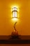 Interior wall lamp in hotel with coconut decoration on desk