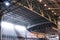Interior of warehouse. large metal structures, ceiling. roof. concept production and installation of equipment for rooms, lighting