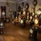 The interior of the watch workshop, a room with a large number of different clocks, an unusual interior of the room,
