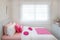 Interior of White bedroom with double bed and pink pillows and bookshelf at home