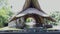 The interior of the yoga place. Thatched tropical roof of the yellow color. Modern bamboo building with a reed roof