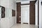 Interiors of the cottage: entrance hall with white furniture