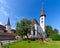 Interlaken. White catholic church with a bell tower on a sunny morning.