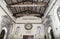 Internal view of medieval Basilica of Sant Aurea in Ostia Antica with its famous ceiling with exposed beams and frescoes - Rome