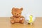 International Childhood Cancer Awareness month, Children toy with golden yellow color Ribbon with Piggy Bank for Donation, Charity