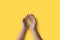International Childhood Cancer Day. Child hands holding yellow gold ribbon. Sarcoma Awareness, Bone cancer, childhood cancer