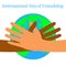 International Day of Friendship. 30 July. Hands of people of different nationalities. They stretch to make a handshake. Planet Ear