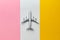 International flights concept with airplane toy on a colorful background