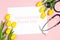 International Nurse Day background with yellow tulips and stethoscope on pink