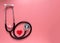 International`s nurse day, week concept, stethoscope and red heart on pink background with copy space. Space for text.