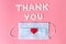 International`s nurses day, week concept, Text Thank you by tablets and red heart on pink background.