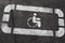 International Symbol of Access Wheelchair Symbol Handicap Sign on asphalt parking permit close up view