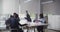 International team of business colleagues in protective masks working together in office boardroom