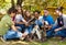 International teens setting up bonfire together