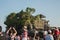 International tourists enjoying Tanah Lot temple view.