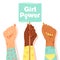 International Women`s Day concept. Woman`s fists showing their power. Girlâ€™s hand holding a nameplates with inscription `Girl p